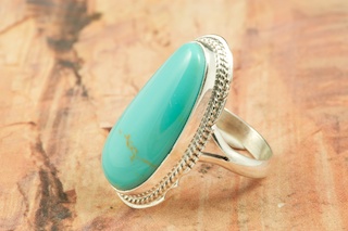Genuine Manassa Turquoise set in Sterling Silver Ring. This Turquoise is also referred to as King�s Manassa Turquoise. The Manassa Turquoise mine is located in Manassa, Conejos County, Colorado. Created by Navajo Artist Larson Lee. Signed by the artist.